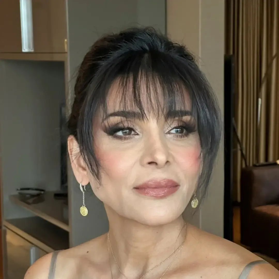 The same client after makeup & hair at home by Studio Name
