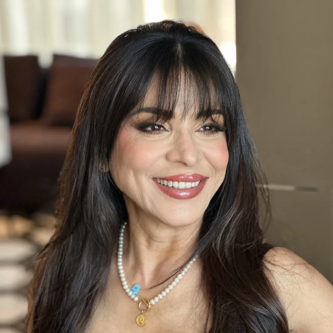 The same client after makeup & hair at home by Studio Name